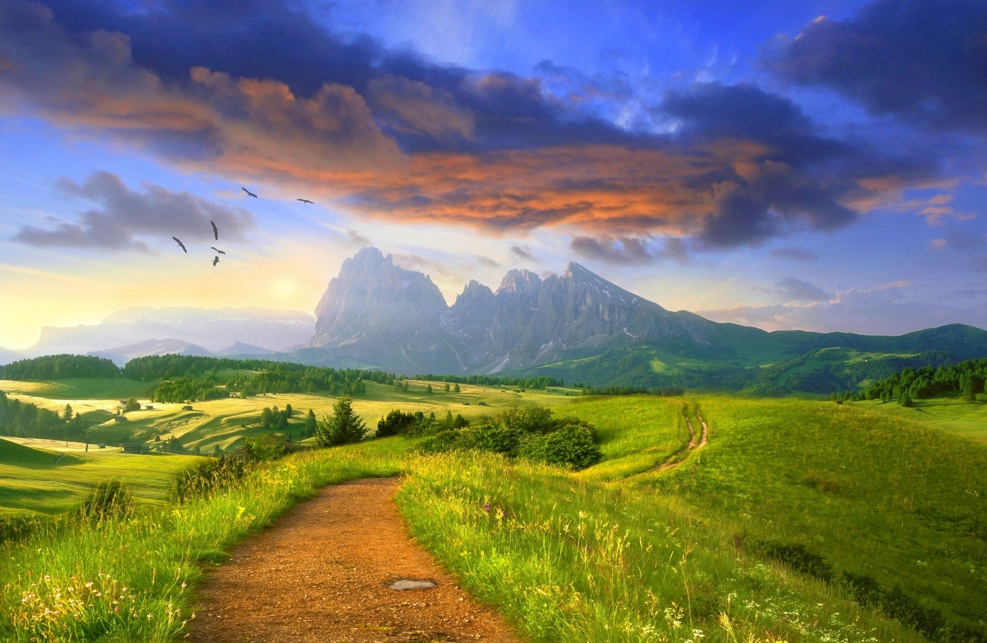 A stunning view of the Dolomites featuring a winding path through a vibrant green field, beneath a dramatic cloud-filled sky, capturing the beauty of nature in a breathtaking landscape.