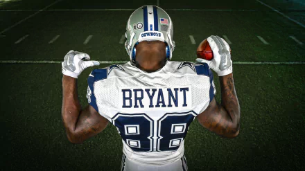 HD PC desktop wallpaper featuring Dallas Cowboys player Bryant wearing jersey number 88, holding a football poised on a dimly lit field.