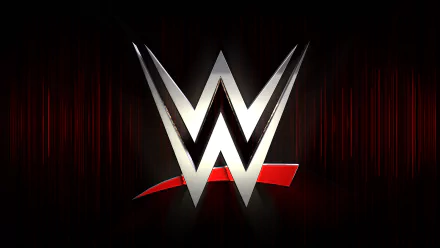 A striking HD desktop wallpaper featuring the silver WWE logo on a dark background, showcasing the dynamic energy of sports entertainment.