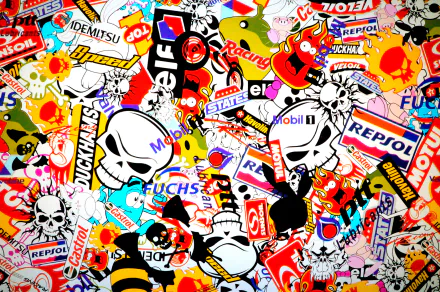 HD desktop wallpaper featuring a vibrant sticker bomb design with various colorful stickers overlaid.