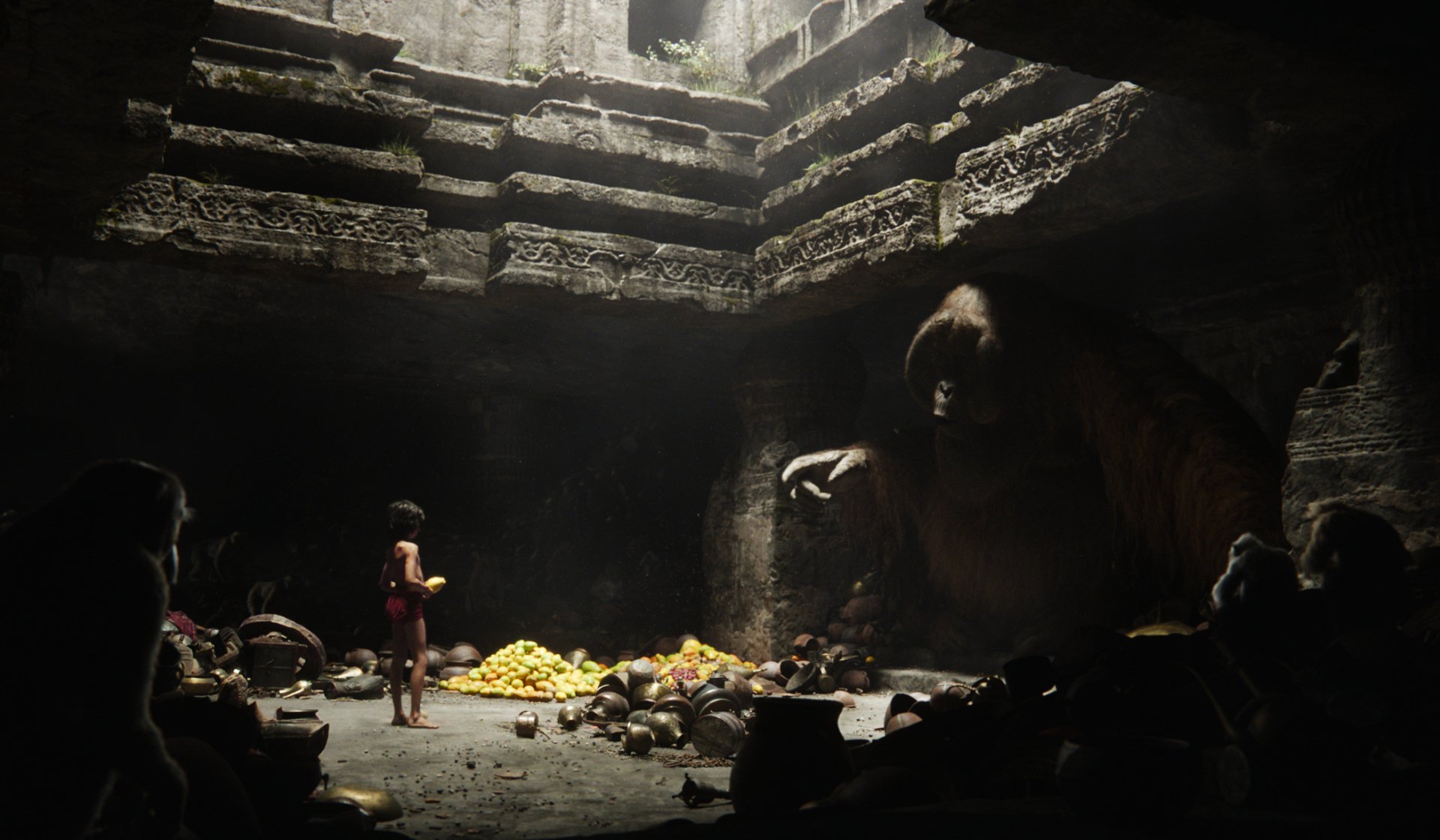 HD PC desktop wallpaper from the movie The Jungle Book (2016) depicting Mowgli standing inside an ancient, dimly lit stone temple with a large ape-like creature.