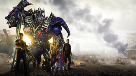 HD desktop wallpaper featuring Optimus Prime from Transformers: Age of Extinction, standing with characters amidst a dramatic, smoky landscape.