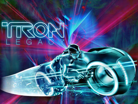 TRON: Legacy movie 2K Quad HD PC wallpaper featuring a neon-blue light-cycle rider streaking through a magenta and cyan digital grid beneath the film logo.