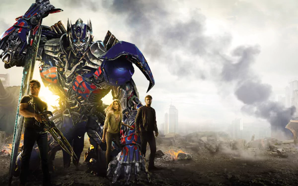 HD desktop wallpaper featuring Optimus Prime from Transformers: Age of Extinction, standing with characters amidst a dramatic, smoky landscape.