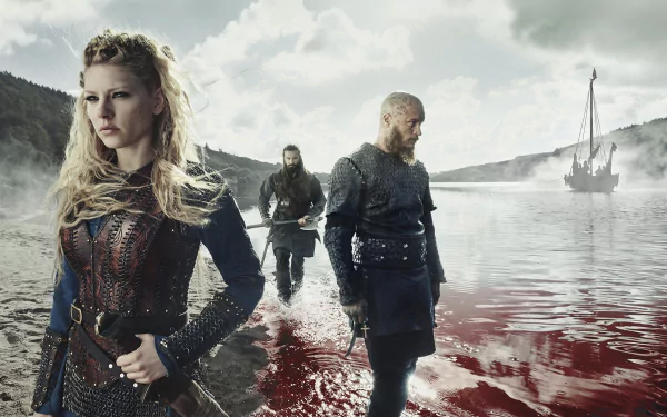 Lagertha (Katheryn Winnick) and key characters from the TV show Vikings (2013) stand in a misty, blood-red shoreline with a Viking ship in the foggy background.