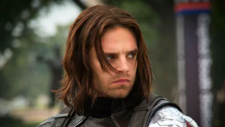 Bucky Barnes, portrayed by Sebastian Stan, is featured in this HD wallpaper from Captain America: The Winter Soldier, showcasing his intense expression and iconic Winter Soldier look.