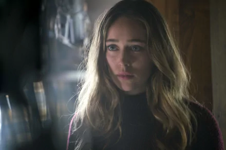 Alycia Debnam-Carey appears in a contemplative moment, captured in this HD wallpaper from the TV show Fear the Walking Dead, featuring a moody, atmospheric setting.