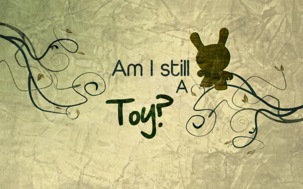 A whimsical HD desktop wallpaper featuring the phrase Am I still a Toy? alongside a playful silhouette and decorative vine elements, embodying a thoughtful and artistic statement.