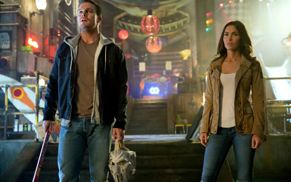 4K Ultra HD desktop wallpaper featuring Megan Fox as April O’Neil in the movie Teenage Mutant Ninja Turtles: Out Of The Shadows, standing in a vibrant urban setting.