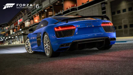 HD PC desktop wallpaper and background from the video game Forza Motorsport 6: rear three-quarter view of a blue Audi R8 in a nighttime pit lane with glossy reflections.