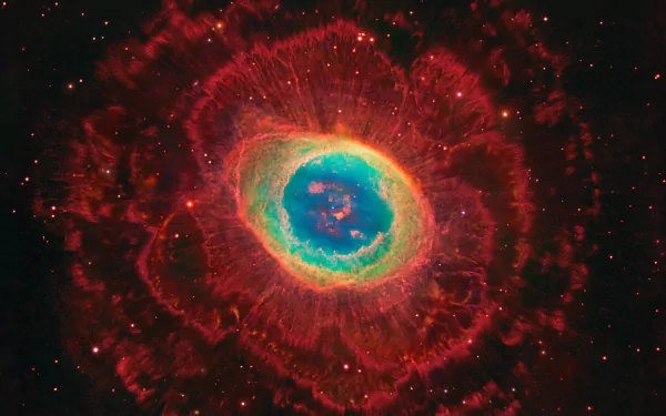 A vibrant supernova explodes in a cosmic display, showcasing swirling colors of red, blue, and green against a star-filled backdrop in this stunning HD space-themed wallpaper.