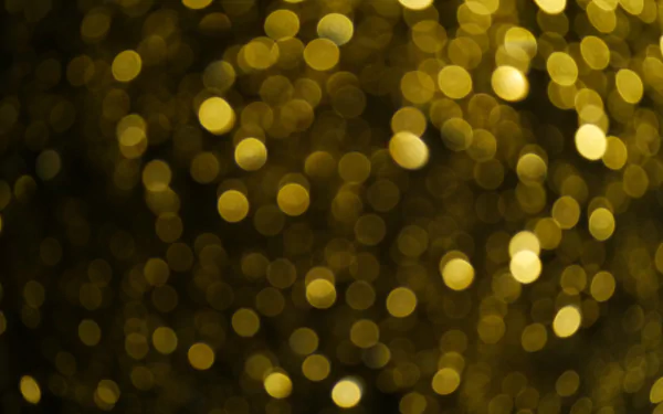 Artistic 4K Ultra HD PC desktop wallpaper featuring golden glitter and warm bokeh lights creating a shimmering, abstract background.