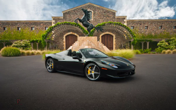 A sleek black Ferrari 458 Spider parked in front of a stunning stone building and a striking horse statue, showcasing the allure of supercars in a captivating setting.
