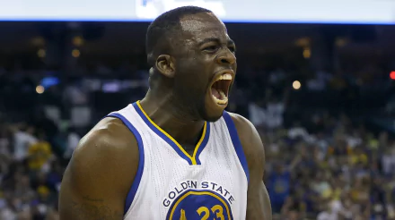 A dynamic image of a Golden State Warriors player celebrating passionately, showcasing the intensity of sports. This HD wallpaper captures the excitement of basketball.