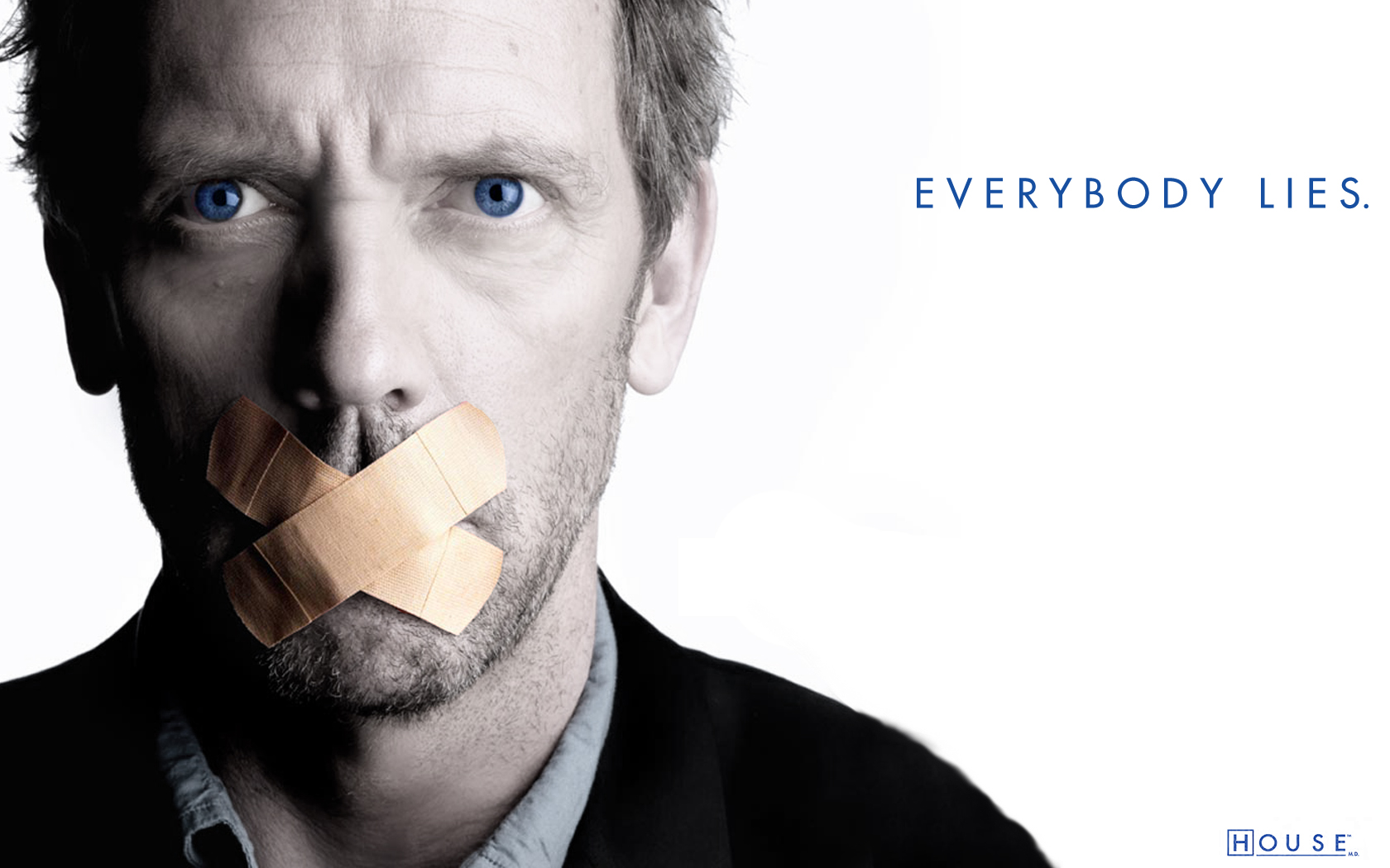 Hugh Laurie portraying Gregory House on a high-definition desktop wallpaper.