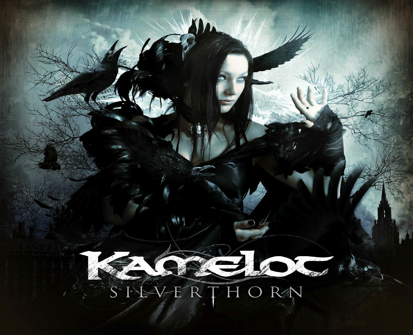 HD PC desktop wallpaper featuring a dark, gothic-themed image of a woman surrounded by ravens, with Kamelot and Silverthorn text, related to the music band Kamelot.