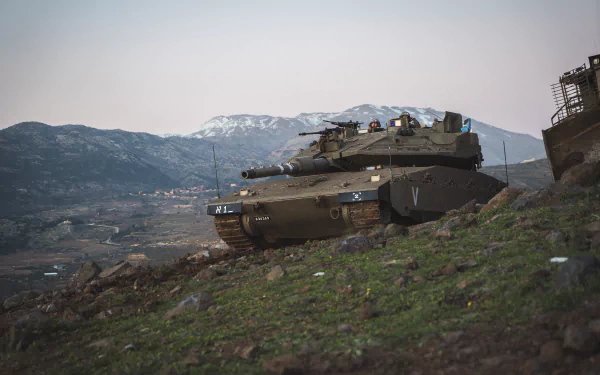 4K Ultra HD PC desktop wallpaper of a Merkava main battle tank resting on a grassy hillside, overlooking a valley with distant snow-capped mountains under a pale sky.