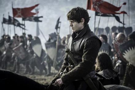 A striking 4K Ultra HD wallpaper featuring Iwan Rheon as Ramsay Bolton from the TV show Game of Thrones, set against a backdrop of a battle-ready army and waving flags.