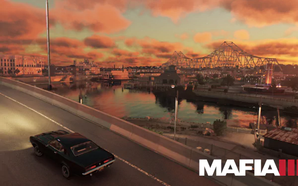 A scenic view from Mafia III, featuring a classic car on a highway with a vibrant sunset and a city skyline reflecting on the water. An immersive HD wallpaper for fans of the game.