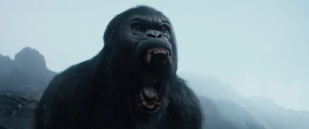 Roaring gorilla from The Legend of Tarzan movie, dramatic HD PC desktop wallpaper showing an open-mouthed ape against a misty jungle backdrop.