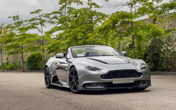 Silver Aston Martin Vantage Roadster parked outdoors, showcased in sharp 4K Ultra HD as a sleek, high-performance vehicle and desktop wallpaper background.