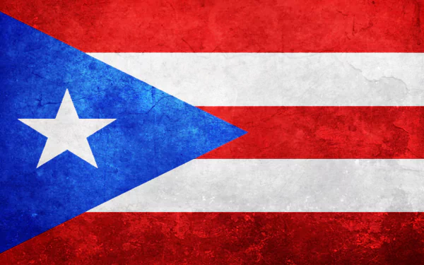 HD desktop wallpaper featuring a textured Puerto Rico flag with red and white stripes, a blue triangle, and a white star.