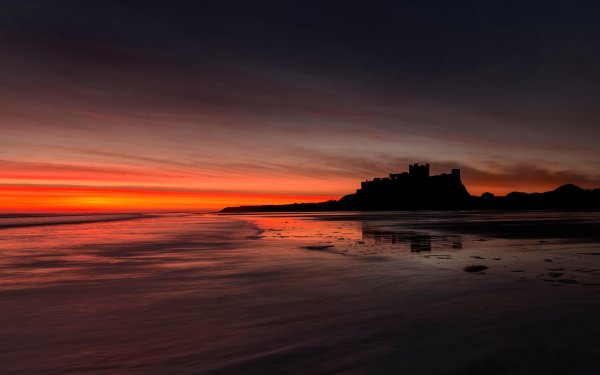 Man Made Bamburgh Castle Castles United Kingdom England Castle Silhouette Beach Sunset Horizon orange HD Wallpaper | Background Image