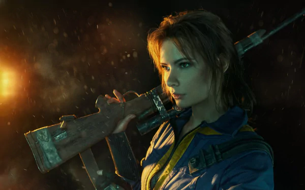 A woman in Fallout 4 cosplay as the Sole Survivor stands confidently with a weapon, set against a dramatic background. This HD image captures the essence of the game's post-apocalyptic world.