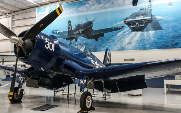 A Vought F4U Corsair warplane displayed in a museum hangar with a mural of military aircraft over the ocean, captured in 4K Ultra HD quality.