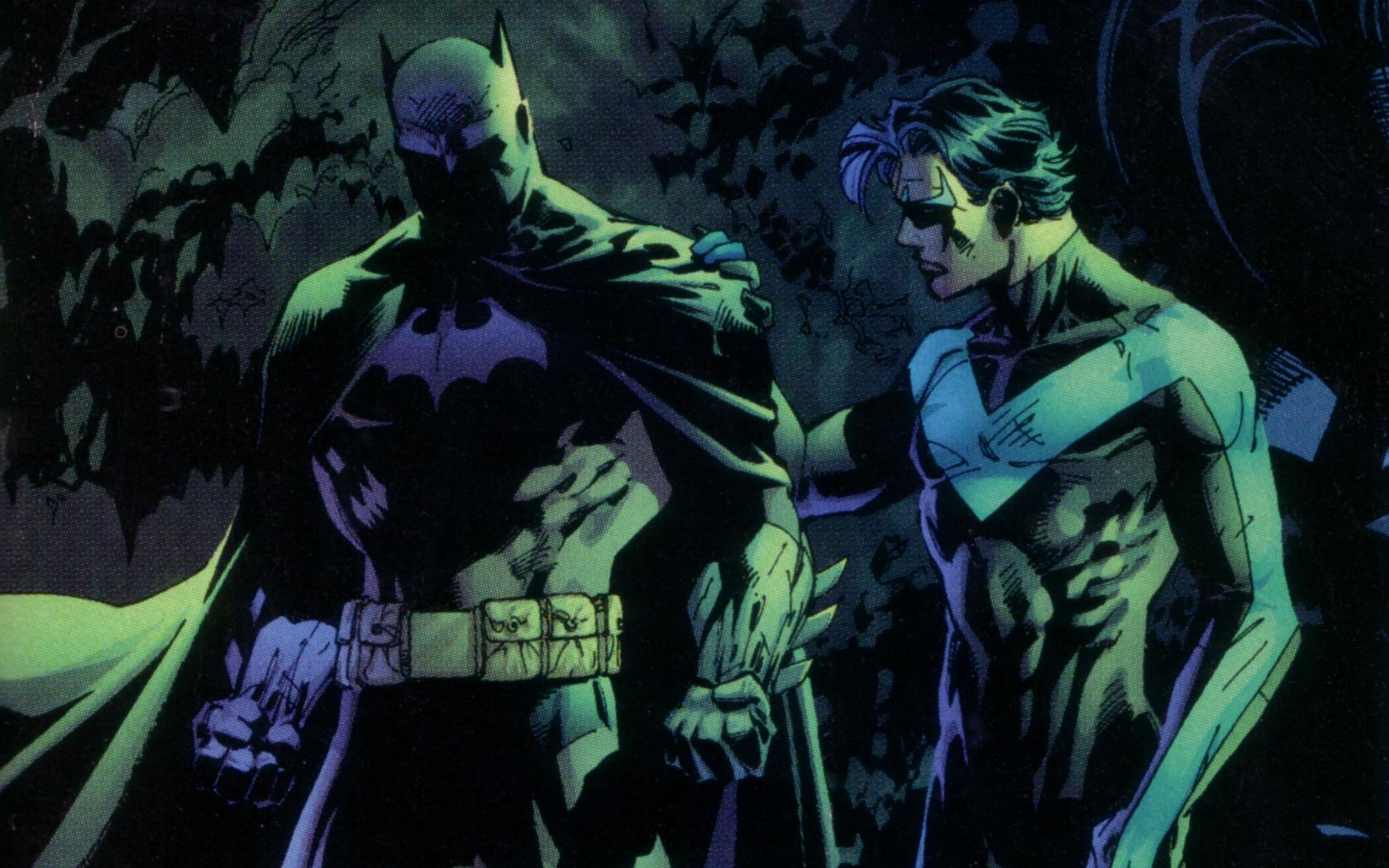 Nightwing and Batman, standing side by side in the night.