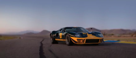 Tilt-shift black and orange Ford GT40 supercar on a racetrack, captured in high definition for a striking PC desktop wallpaper.