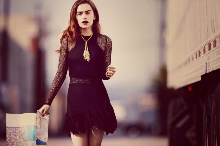 Brunette actress in a black dress with mesh sleeves and bold lipstick walking while carrying shopping bags — 2K Quad HD PC desktop wallpaper