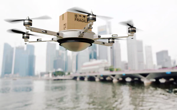 A drone carrying a box labeled FRAGILE flies over a cityscape, showcasing advanced technology in a vibrant urban setting. This image serves as a striking 4K Ultra HD wallpaper.