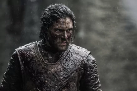 Kit Harington as Jon Snow from Game of Thrones, captured in a dramatic, gritty scene, showcasing the character's resilience amidst a rainy battlefield. High-resolution 4K background.