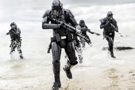 HD desktop wallpaper featuring stormtroopers from Star Wars: Rogue One, armed and advancing from the sea in dramatic action scene.