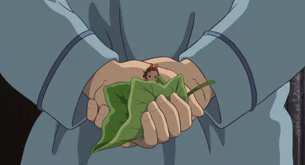 HD PC desktop wallpaper from the anime The Secret World of Arrietty: giant hands gently hold a green leaf with tiny Arrietty perched on it.