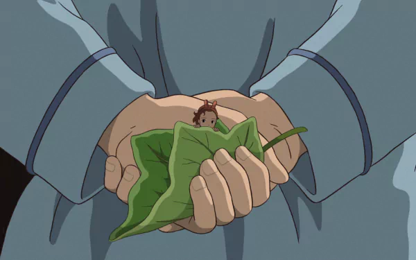 HD PC desktop wallpaper from the anime The Secret World of Arrietty: giant hands gently hold a green leaf with tiny Arrietty perched on it.