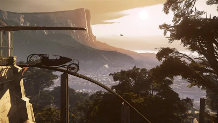 HD PC desktop wallpaper from the video game Dishonored 2, featuring a carriage on a curved rail overlooking a sunlit cityscape with mountains and trees at sunrise or sunset.
