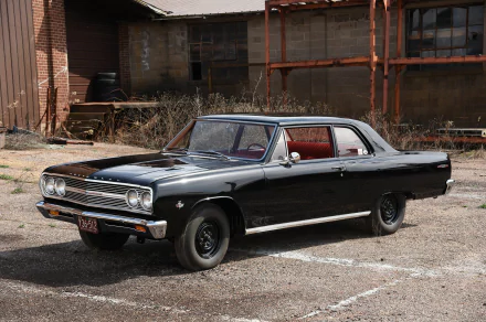 Black Chevrolet Chevelle muscle car parked outdoors, showcased as a high-definition desktop wallpaper and background.