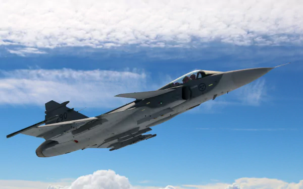 HD desktop wallpaper featuring a Saab JAS 39 Gripen military jet fighter soaring against a blue sky with scattered clouds.