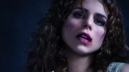 HD PC desktop wallpaper featuring a close-up of a woman with curly hair and dramatic makeup from the TV show Penny Dreadful.