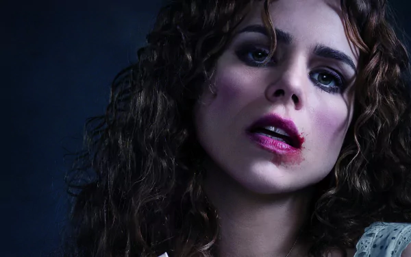 HD PC desktop wallpaper featuring a close-up of a woman with curly hair and dramatic makeup from the TV show Penny Dreadful.