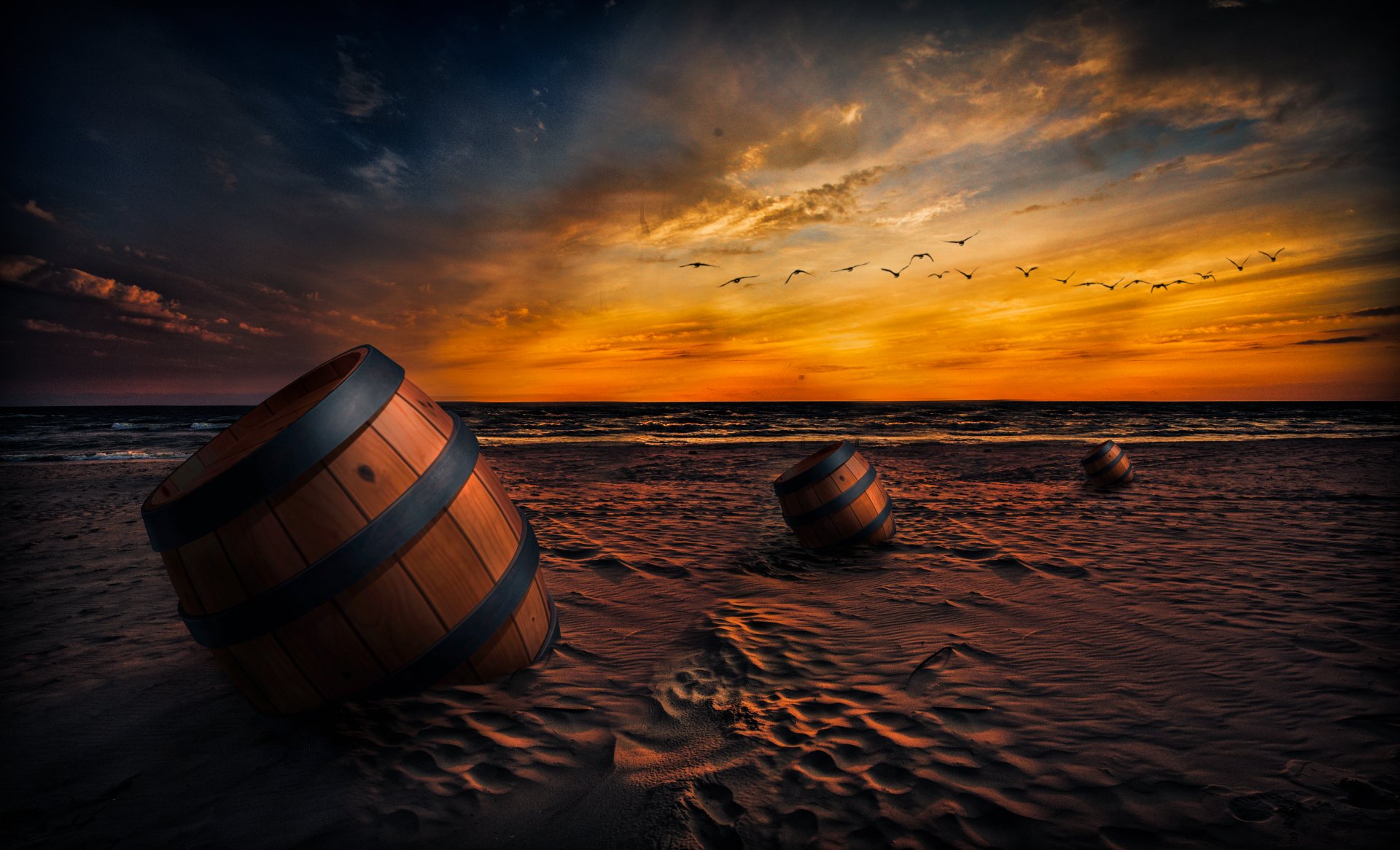 4K Ultra HD artistic beach wallpaper showing barrels on sand under a dramatic sunset sky with birds flying near the horizon.