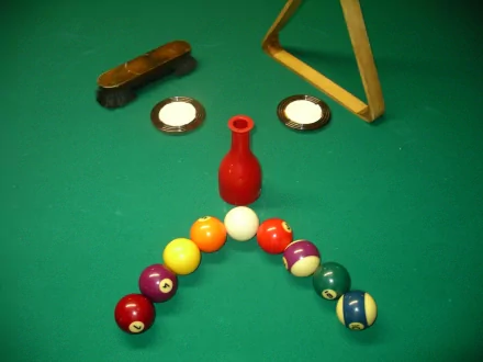 HD PC desktop wallpaper featuring a creative billiard setup forming a funny, smiley face with colorful balls and cues on a green table.