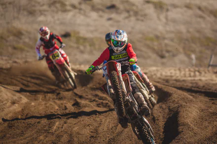 A dynamic motocross scene featuring racers skillfully navigating dirt tracks on motorcycles, captured in stunning 4K Ultra HD for an exhilarating sports backdrop.