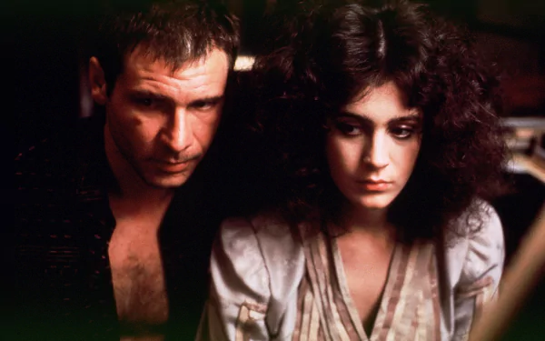 HD desktop wallpaper from the movie Blade Runner: a moody, dimly lit close-up of a rugged man and a contemplative woman sitting close, conveying tense noir sci‑fi atmosphere.