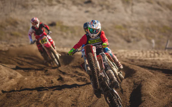 A dynamic motocross scene featuring racers skillfully navigating dirt tracks on motorcycles, captured in stunning 4K Ultra HD for an exhilarating sports backdrop.