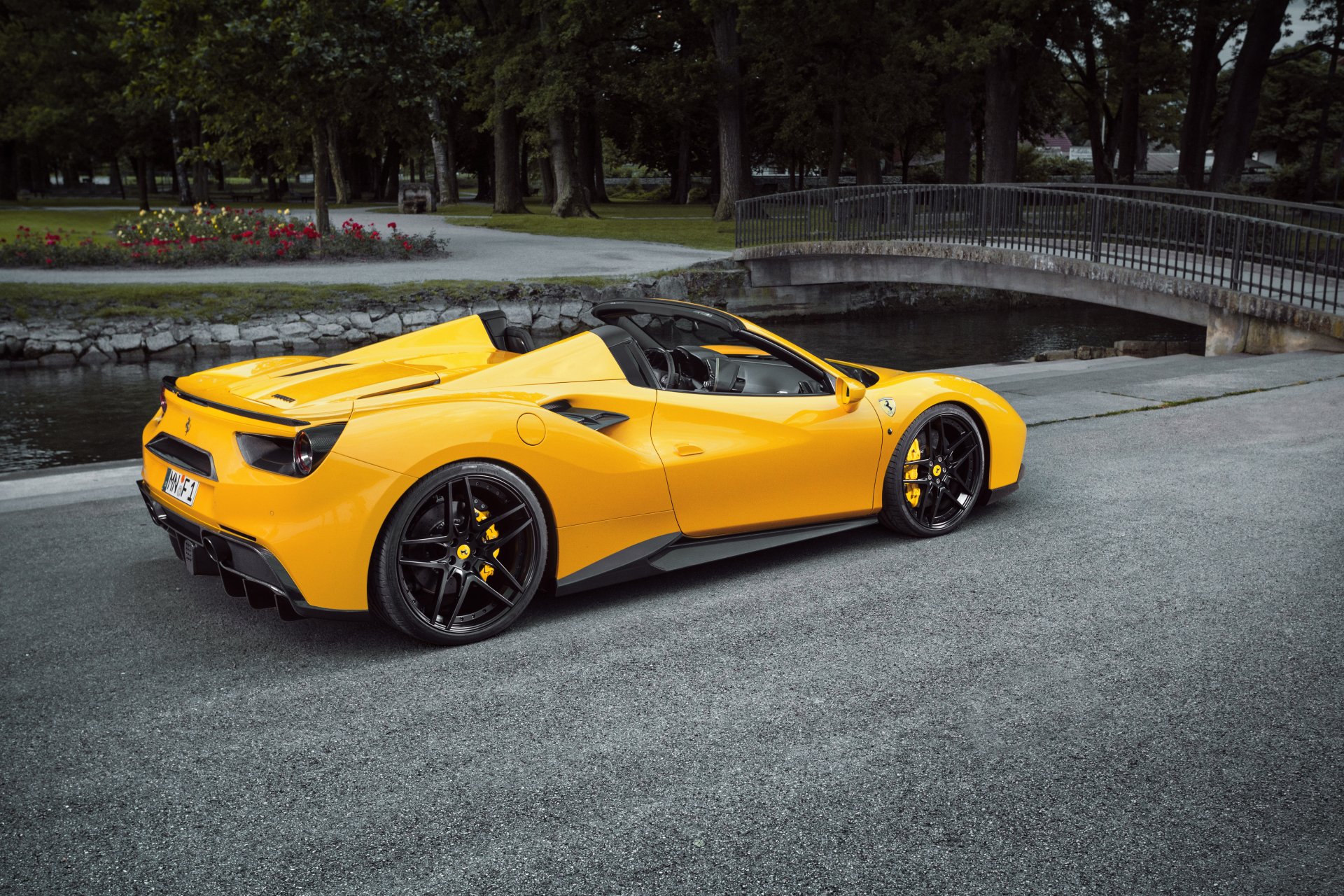 Yellow Ferrari 488 Spider supercar parked near a bridge, captured in 4K Ultra HD for a PC desktop wallpaper and background.