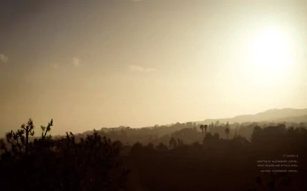 HD PC desktop wallpaper featuring a hazy sunset over a silhouetted landscape, inspired by the music and aesthetic of Nine Inch Nails.