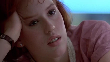 HD desktop wallpaper featuring Molly Ringwald as Claire Standish from the movie The Breakfast Club, showcasing a close-up of her thoughtful expression.